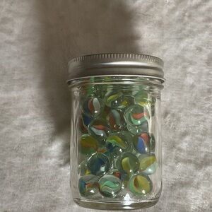 Colorful Glass Marbles in Jar